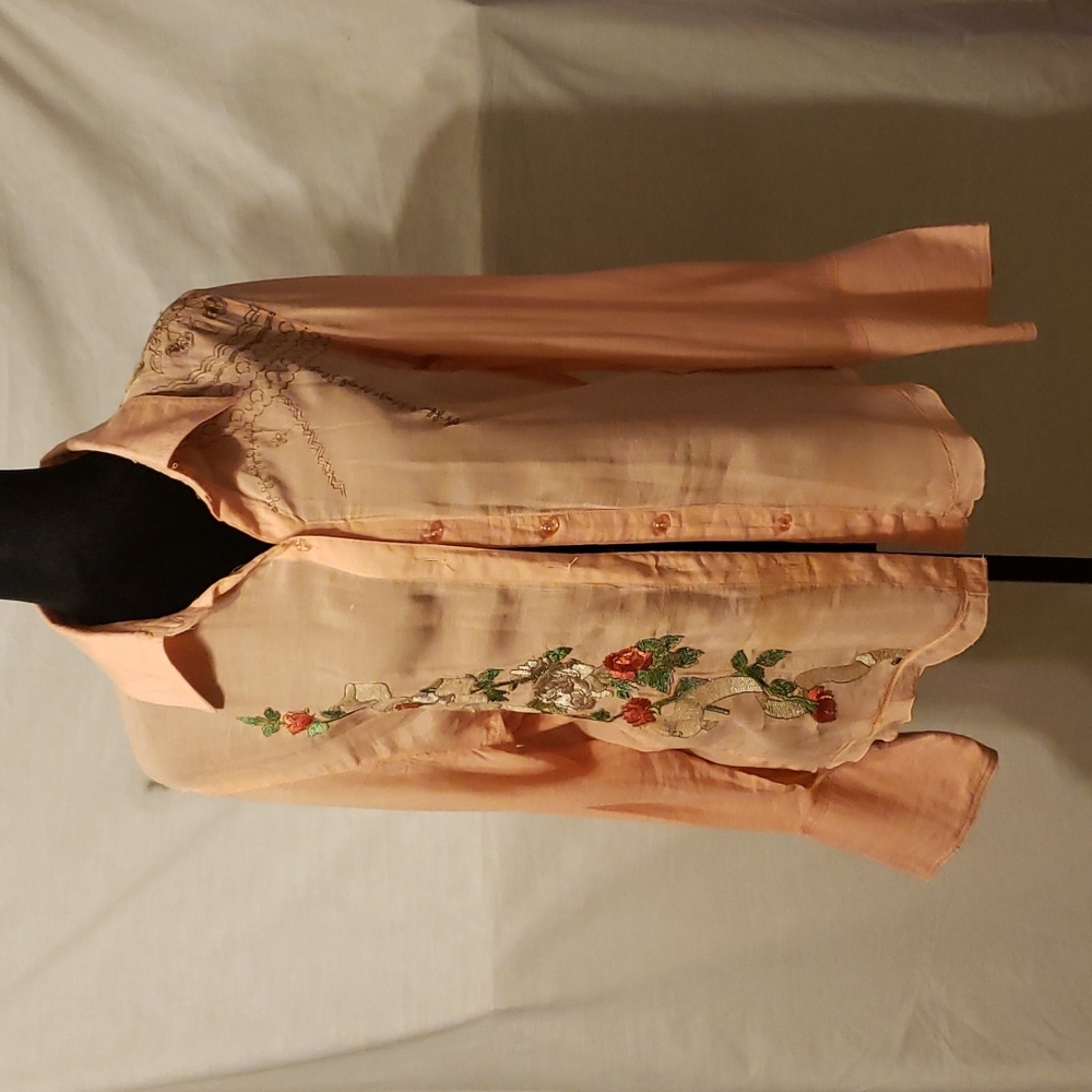 Peach colored sheer long sleeve top